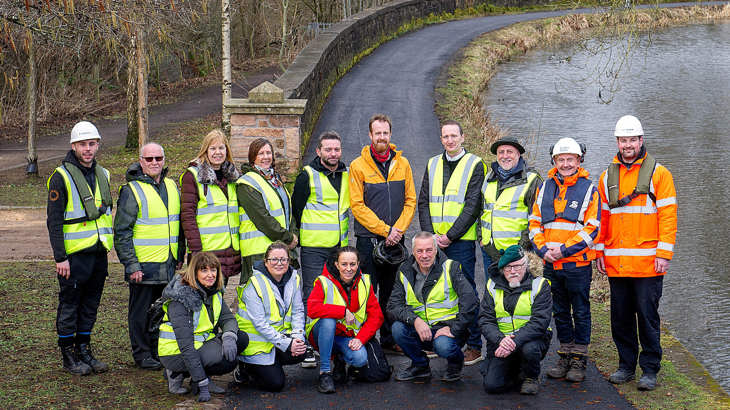 Walk Wheel Cycle Trust and Scottish Canals staff pose with members of the local community on the Monkland Canal towpath