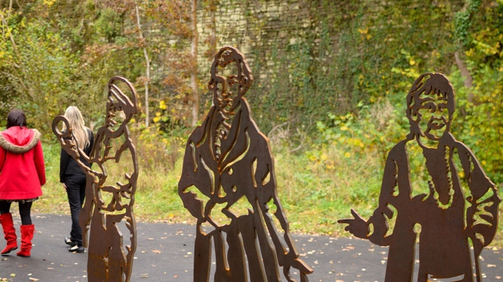 Portrait benches showing Richard Burton, Rob Brydon and Dick Wagstaff at Quoits Wood Crossing in the Afan Valley