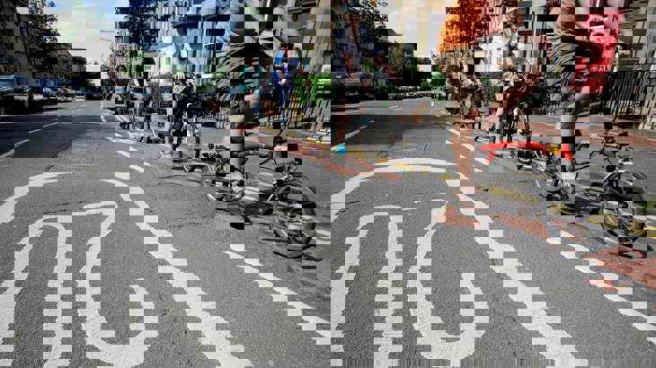 people cycling on 20 mph road