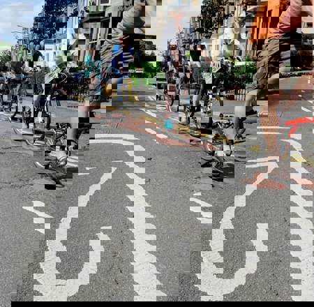 people cycling on 20 mph road