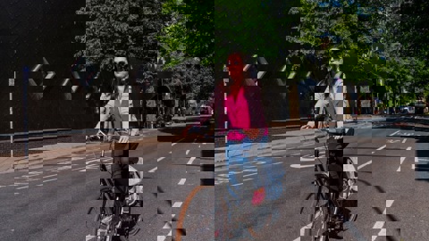Female cyclist in cycle lane