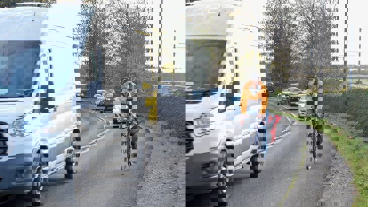 Cyclist on a busy road