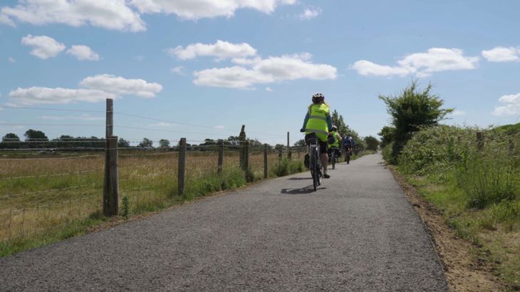 people cycling on newly improved walking, wheeling and cycling route in East Sussex