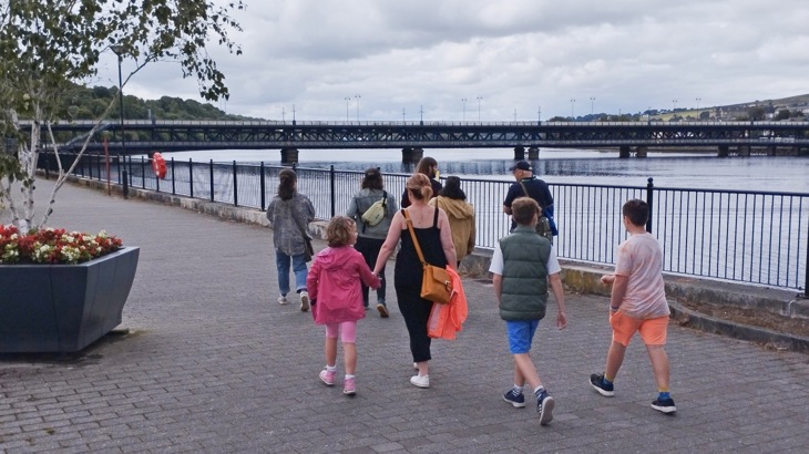 A group of walkers during Foyle Maritime Festival alongside the River Foyle in Derry Londonderry