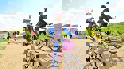 Mother and daughter cycling along a traffic-free National Cycle Network path