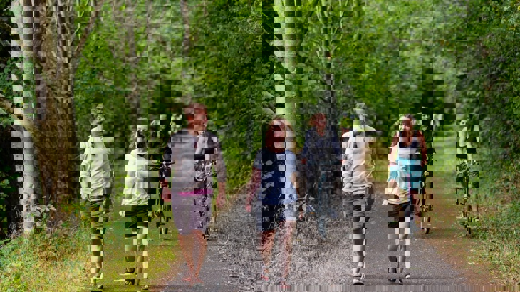 People walking and cycling along a traffic-free shared-use path