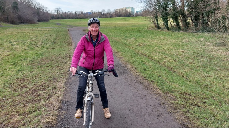 Karen Wilson is pictured with her bicycle in an Edinburgh park