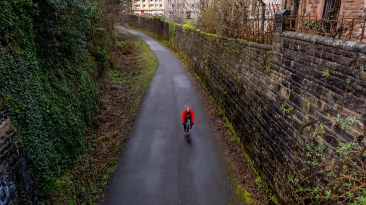 Jon Jewitt approaching a bridge while cycling on National Cycle Network 7