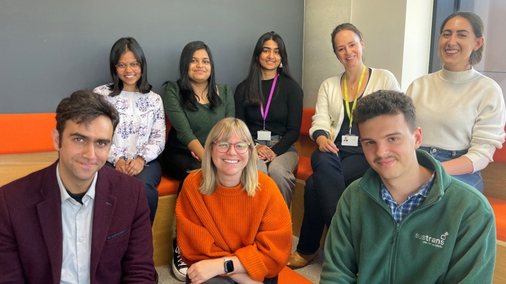 Walk Wheel Cycle Trust in Wales's design and engineering team sat together for a photo, smiling at the camera.