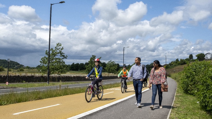 Young people cycling on segregated infrastructure on Dumbarton Road.