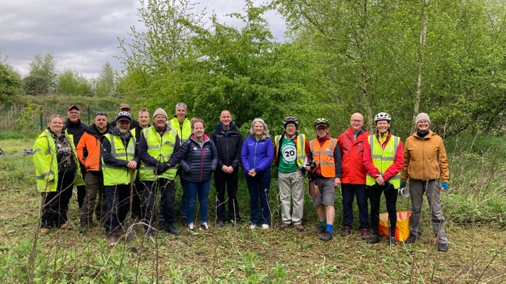 A group shot of Walk Wheel Cycle Trust staff and volunteers at the celebration event for 20 years of volunteering in northeast Wales.