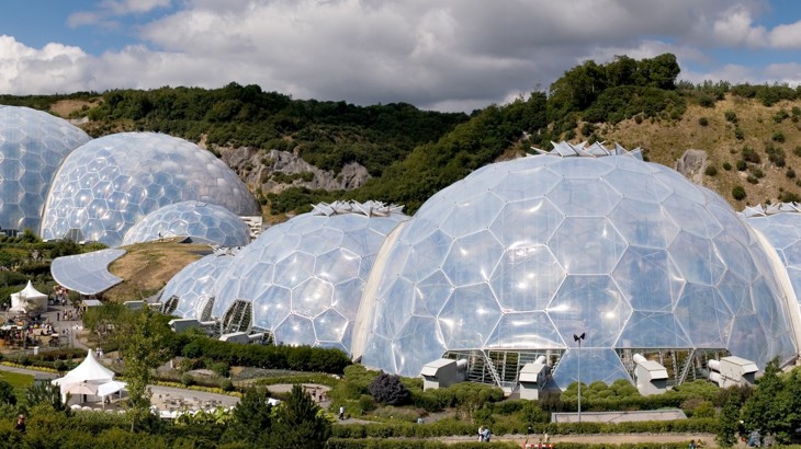 The domes of the Eden Project viewed from a higher up vantage point, showing how they nestle into the natural landscape.