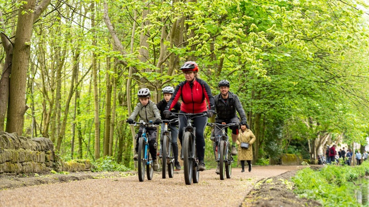 family bike ride along a towpath