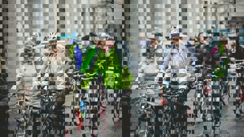 Group of people cycling along road in NI