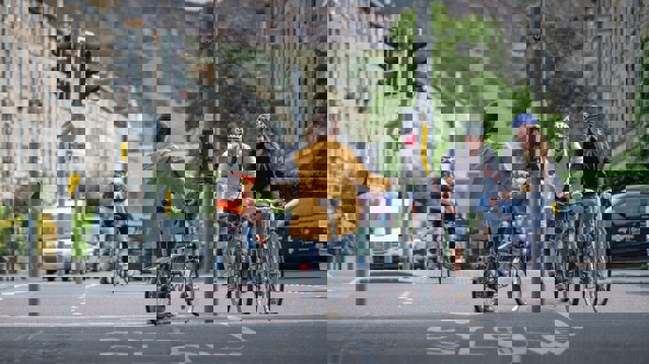 A Woman Standing At Some Traffic Lights In Edinburgh