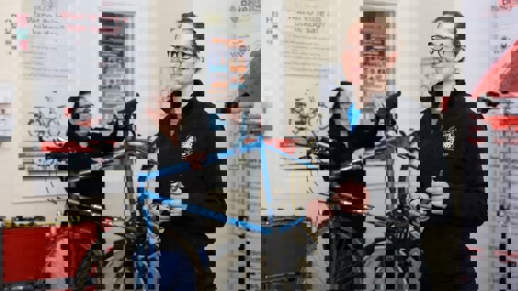 women repairing bikes in active travel hub in Scotland