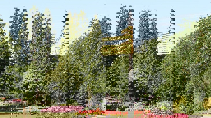 Direction signs in park for Rea Valley Cycle Path and Toilets