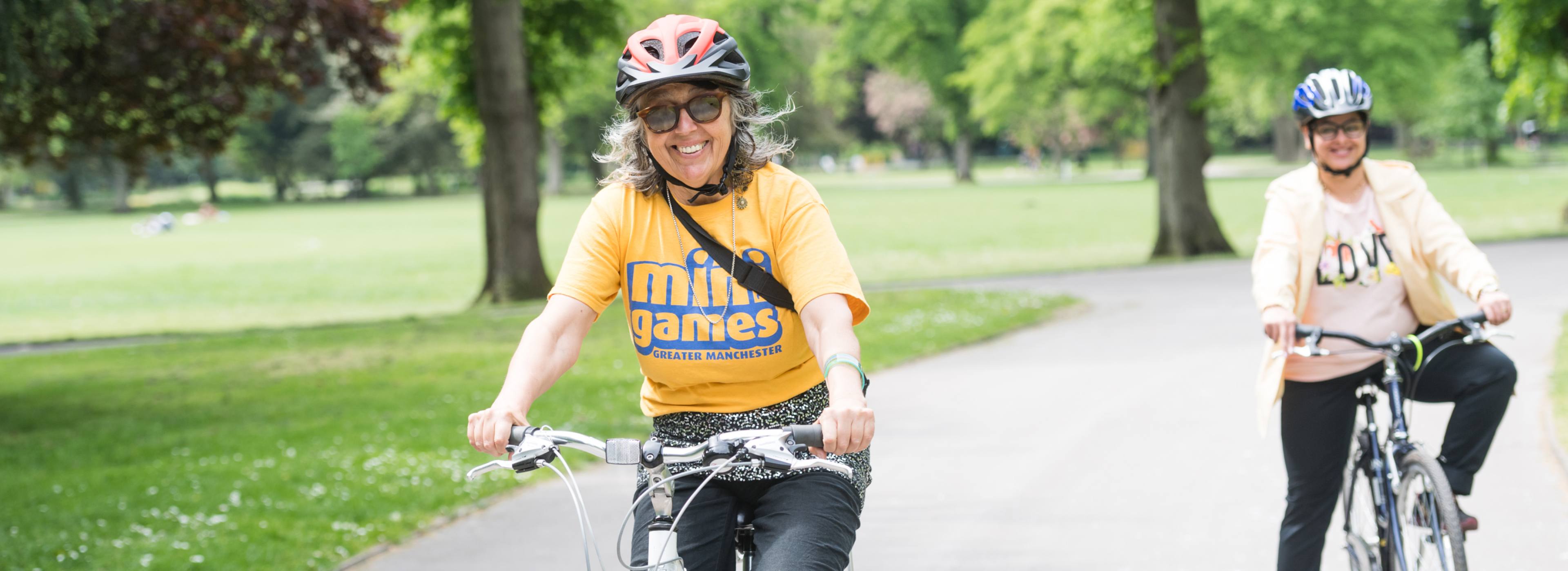 Two women on bikes in Manchester