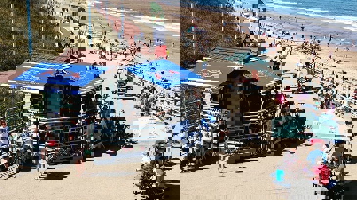 People outside seaside ice-cream shop Di Meos