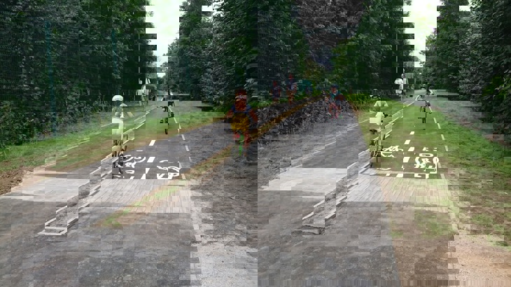 A picture children cycling on the Kingston and Merton path after work was completed