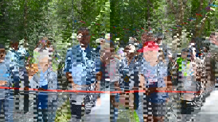 Will Norman cuts the ribbon to open the new bike path