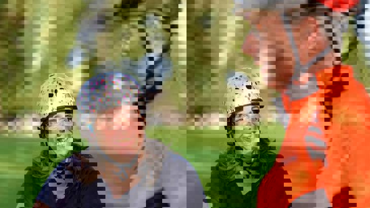 Smiling woman with bike helmet on