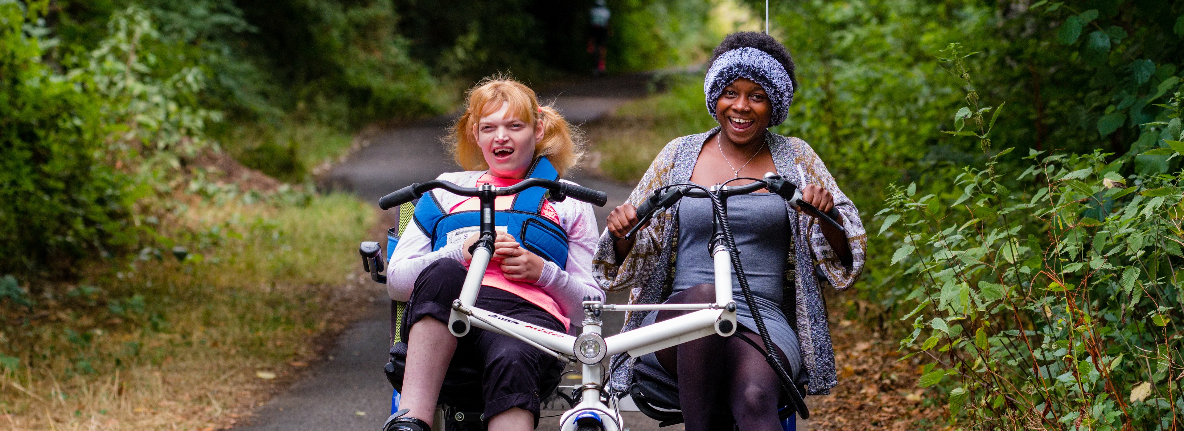Adapted cycle riders on a traffic-free route