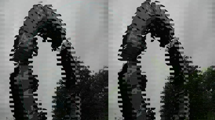 Circular metal sculpture made of train coal carriages