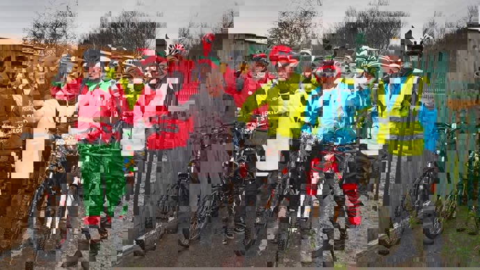 A group of people dressed as Santa and elves pose for a photo on the Castleford Greenway