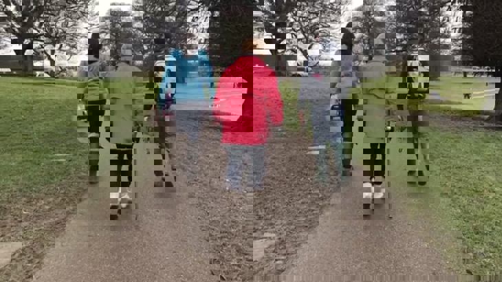 Jill walking with her family before her knee operation and cycling recovery