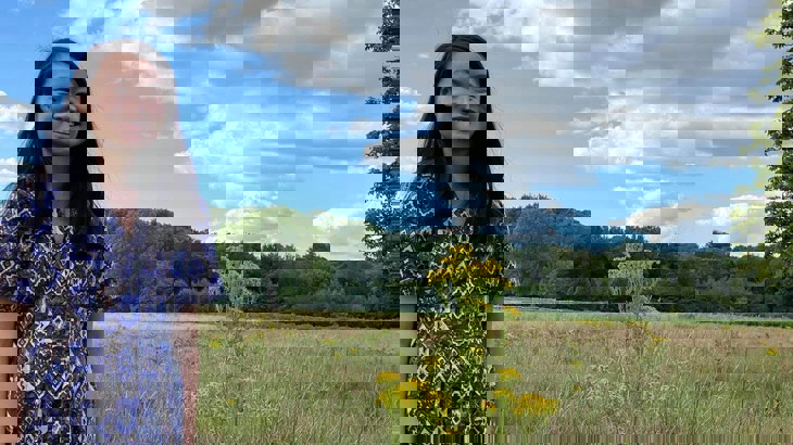 Carmen Szeto stood with yellow field behind her