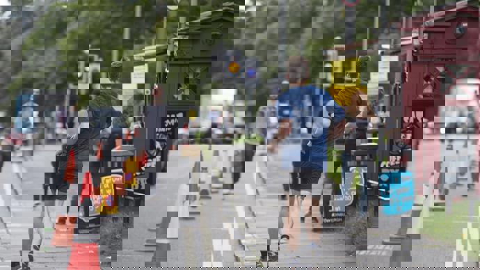 People practicing physical distancing on Bruntsfield Place following Spaces for People interventions