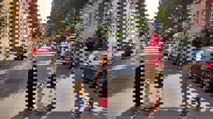 Family hang out in the middle of a road that has been closed to through traffic