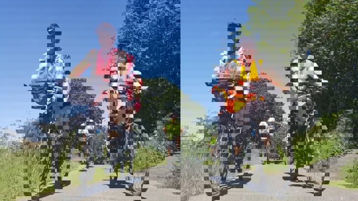 people cycling outside in the sunshine