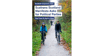 a couple on bicycles cycle on a path under a title which reads "Walk Wheel Cycle Trust in Scotland manifesto asks for political parties"