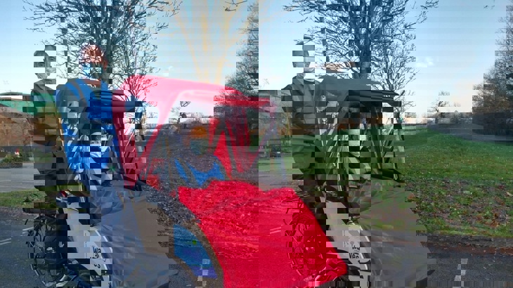 person riding and person sitting in trishaw taxi