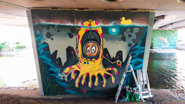 A fun cartoon octopus is painted in vibrant colour on a tunnel in Almondbank