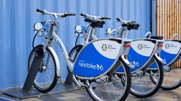 Three West Midlands rental cycles in a rack