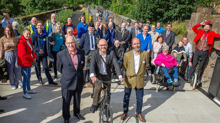 John Lauder, Patrick Harvie and Richard Miller open the Bowline link along National Cycle Network Route 7 along with walkers, wheelers and cyclists from the local community.