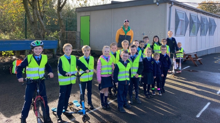 Pupils from Gaelscoil na Daróige, Derry~Londonderry with Walk Wheel Cycle Trust in Northern Ireland Schools Officer, Richard Farrow
