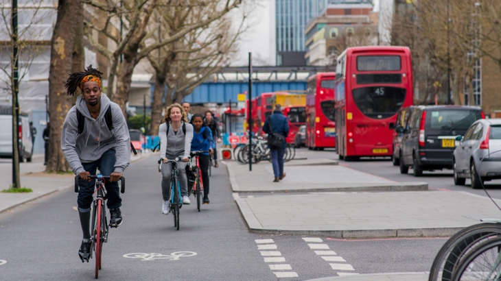 People cycling in London separate cycling lane