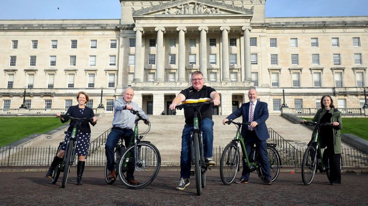 Politicians try out e-bikes in front of Stormont building
