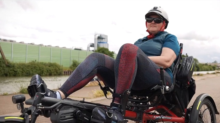 Debbie, a recumbent trike rider, cycling along the canal into Gloucester