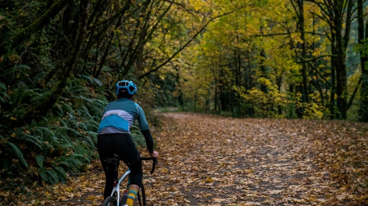 Cyclist on autumnal trail